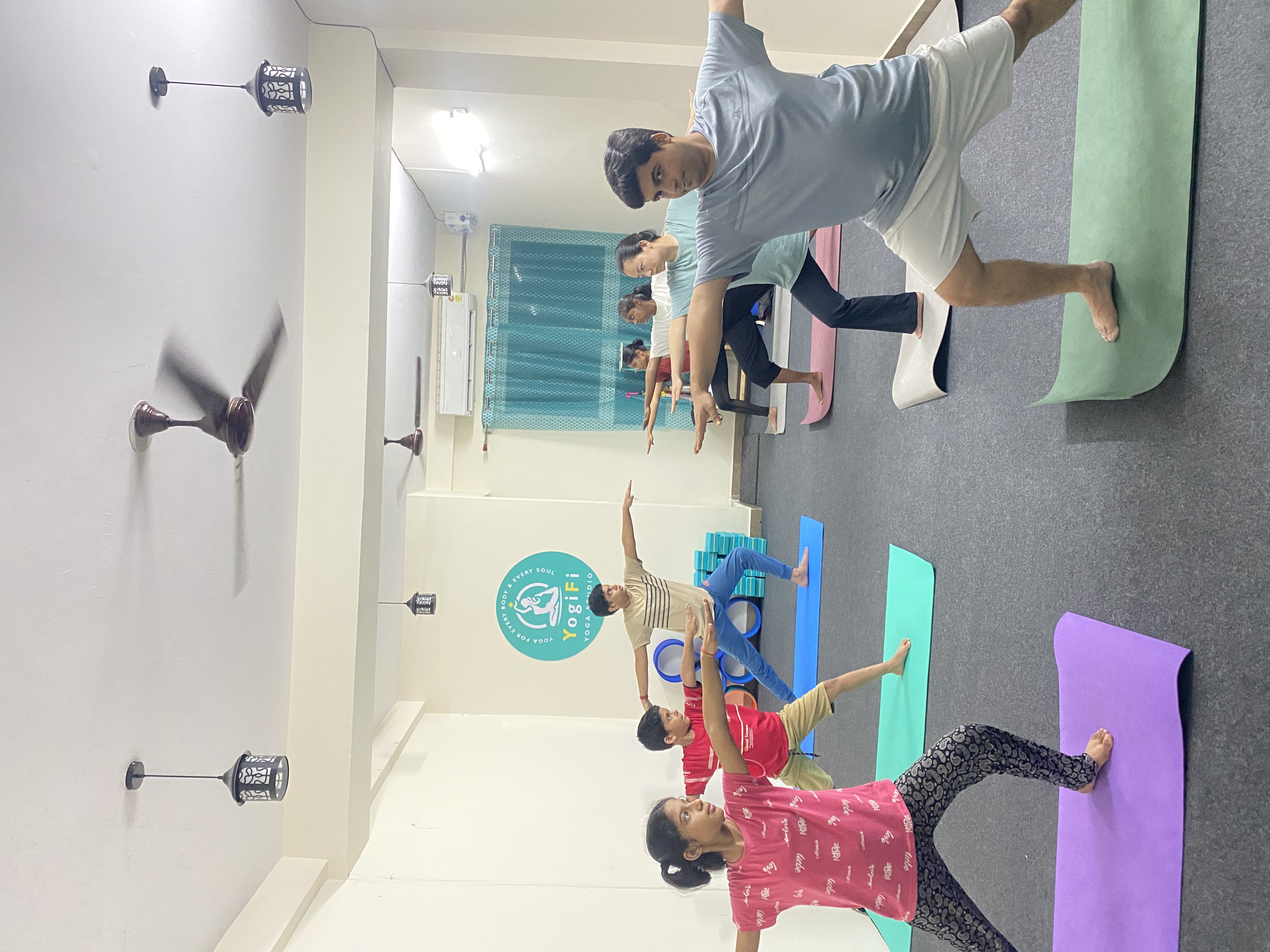 The welcoming reception and lounge area of YogiFi Yoga Studio.